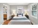 Cozy bedroom with hardwood floors and a view of the backyard at 3015 Olive Branch Rd, Greenwood, IN 46143