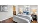 Well-lit bedroom featuring hardwood floors and modern decor at 3015 Olive Branch Rd, Greenwood, IN 46143