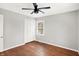 Bright bedroom with hardwood floors and ceiling fan at 3015 Olive Branch Rd, Greenwood, IN 46143
