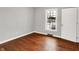 Bright bedroom with hardwood floors, a window, and a white door at 3015 Olive Branch Rd, Greenwood, IN 46143