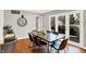 Dining area with a large table and chairs, and french doors leading to the backyard at 3015 Olive Branch Rd, Greenwood, IN 46143