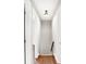 Upstairs hallway with hardwood floors and neutral paint at 3015 Olive Branch Rd, Greenwood, IN 46143