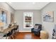 Bright home office features a large window, built-in desk, and comfortable armchair at 3015 Olive Branch Rd, Greenwood, IN 46143