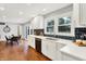 Bright kitchen with white shaker cabinets, quartz countertops, and a farmhouse sink at 3015 Olive Branch Rd, Greenwood, IN 46143
