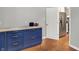Blue kitchen cabinets with a butcher block countertop and gold hardware at 3015 Olive Branch Rd, Greenwood, IN 46143