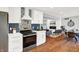 Modern kitchen features white cabinets, stainless steel appliances, and stylish backsplash at 3015 Olive Branch Rd, Greenwood, IN 46143