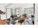 Living room with hardwood floors, featuring a comfortable seating area and a view to kitchen at 3015 Olive Branch Rd, Greenwood, IN 46143