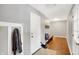 Functional mudroom with built-in bench, coat hooks, and hardwood floors at 3015 Olive Branch Rd, Greenwood, IN 46143