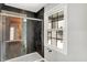 Clean shower with glass enclosure and dark tile at 3015 Olive Branch Rd, Greenwood, IN 46143