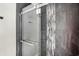 Modern shower with glass enclosure and tile detail at 3015 Olive Branch Rd, Greenwood, IN 46143