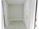 Small basement entry with neutral walls and wood-look flooring at 3153 N Layman Ave, Indianapolis, IN 46218