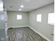Finished basement room with vinyl flooring and windows at 3153 N Layman Ave, Indianapolis, IN 46218