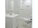 Clean bathroom with white vanity, shower, and toilet at 3153 N Layman Ave, Indianapolis, IN 46218