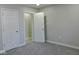 Cozy bedroom with gray carpet and white doors at 3153 N Layman Ave, Indianapolis, IN 46218