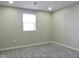 Simple bedroom with gray carpet and a window at 3153 N Layman Ave, Indianapolis, IN 46218
