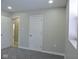 Charming bedroom with gray carpet, white doors and a view into another room at 3153 N Layman Ave, Indianapolis, IN 46218