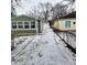 Shared driveway between two houses; partially covered in snow at 3153 N Layman Ave, Indianapolis, IN 46218