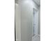 Basement hallway with pocket door and gray walls at 3153 N Layman Ave, Indianapolis, IN 46218