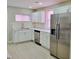 Modern kitchen with stainless steel appliances and white cabinets at 3153 N Layman Ave, Indianapolis, IN 46218