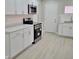 Modern white kitchen with stainless steel appliances at 3153 N Layman Ave, Indianapolis, IN 46218