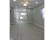 Open concept living area with kitchen and vinyl flooring at 3153 N Layman Ave, Indianapolis, IN 46218
