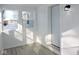 Sunroom with white walls, grey floor, and windows at 3153 N Layman Ave, Indianapolis, IN 46218