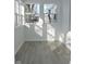 Sunroom with white walls, grey floor, and windows at 3153 N Layman Ave, Indianapolis, IN 46218