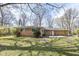 Spacious backyard featuring a brick home with a concrete patio, perfect for outdoor entertaining and relaxation at 3375 Lincoln Rd, Indianapolis, IN 46222