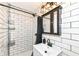 Modern bathroom with subway tile, updated vanity, and shower at 3375 Lincoln Rd, Indianapolis, IN 46222