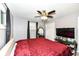 Spacious bedroom featuring a large bed and TV at 3375 Lincoln Rd, Indianapolis, IN 46222