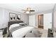 Bedroom with gray bedding and ceiling fan at 3375 Lincoln Rd, Indianapolis, IN 46222