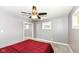 Cozy bedroom with ceiling fan and window at 3375 Lincoln Rd, Indianapolis, IN 46222