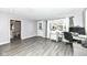 Home office with hardwood floors, desk, and view to backyard at 3375 Lincoln Rd, Indianapolis, IN 46222