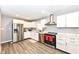Modern kitchen with stainless steel appliances and white cabinets at 3375 Lincoln Rd, Indianapolis, IN 46222