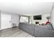 Spacious living room with gray sectional sofa and fireplace at 3375 Lincoln Rd, Indianapolis, IN 46222