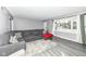 Living room with gray sectional sofa and wood-look floors at 3375 Lincoln Rd, Indianapolis, IN 46222