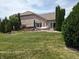 Brick home with patio, hot tub, and landscaped yard at 4139 Bella Ct, Indianapolis, IN 46237