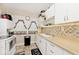 Efficient kitchen with white cabinetry, tile backsplash, and modern appliances at 426 N Euclid Ave, Indianapolis, IN 46201