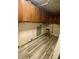 Unfinished basement area with wood cabinets and vinyl flooring at 4349 Alhambra Dr, Anderson, IN 46013