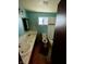Clean bathroom with double sinks, bathtub, and updated fixtures at 4349 Alhambra Dr, Anderson, IN 46013