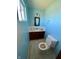 Small bathroom with single sink, toilet, and updated fixtures at 4349 Alhambra Dr, Anderson, IN 46013
