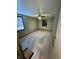Simple bedroom with light grey wood flooring and a ceiling fan at 4349 Alhambra Dr, Anderson, IN 46013