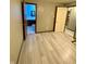 Bedroom with an ensuite bathroom and light grey wood flooring at 4349 Alhambra Dr, Anderson, IN 46013