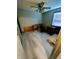 Spacious bedroom with light grey wood flooring and a ceiling fan at 4349 Alhambra Dr, Anderson, IN 46013