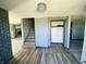 Renovated entryway with stairs, closet, and wood-look flooring at 4349 Alhambra Dr, Anderson, IN 46013
