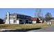 Two-story house requiring renovations, situated on a grassy lot at 4349 Alhambra Dr, Anderson, IN 46013