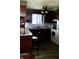 Kitchen features wood cabinets and white appliances at 4349 Alhambra Dr, Anderson, IN 46013