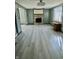 Bright living room with hardwood floors and a stone fireplace at 4349 Alhambra Dr, Anderson, IN 46013