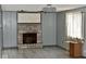 Living room featuring a stone fireplace and hardwood flooring at 4349 Alhambra Dr, Anderson, IN 46013