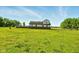 Lush backyard features privacy and serenity for entertaining or enjoying nature at 4450 W 300 N, Fairland, IN 46126